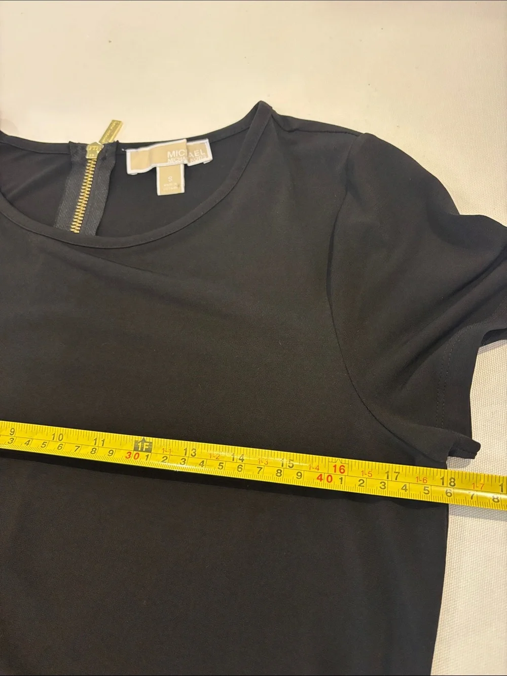 Michael Kors classic black short sleeve A-line with gold zipper mini dress. S